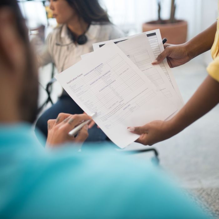 Business professionals analyzing reports during an office meeting.